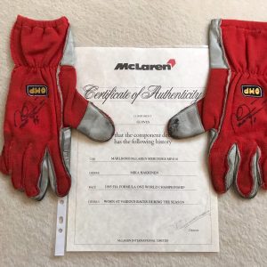 Mika Hakkinen 1996 signed McLaren race used gloves with McLaren COA signed by Ron Dennis