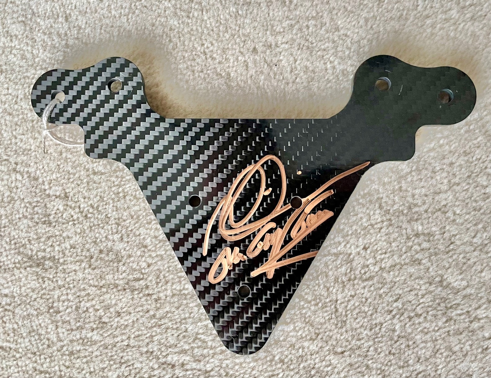 Carbon fibre switch plate hand signed by Mika Hakkinen 'The Flying Finn'