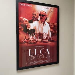 Full size framed ‘Luca, seeing red’ premiere film poster signed by Luca and Bernie