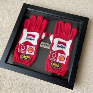 Michael Schumacher hand signed plaque framed with 2002 replica OMP Ferrari gloves