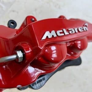 McLaren rear brake caliper in red by AP Racing
