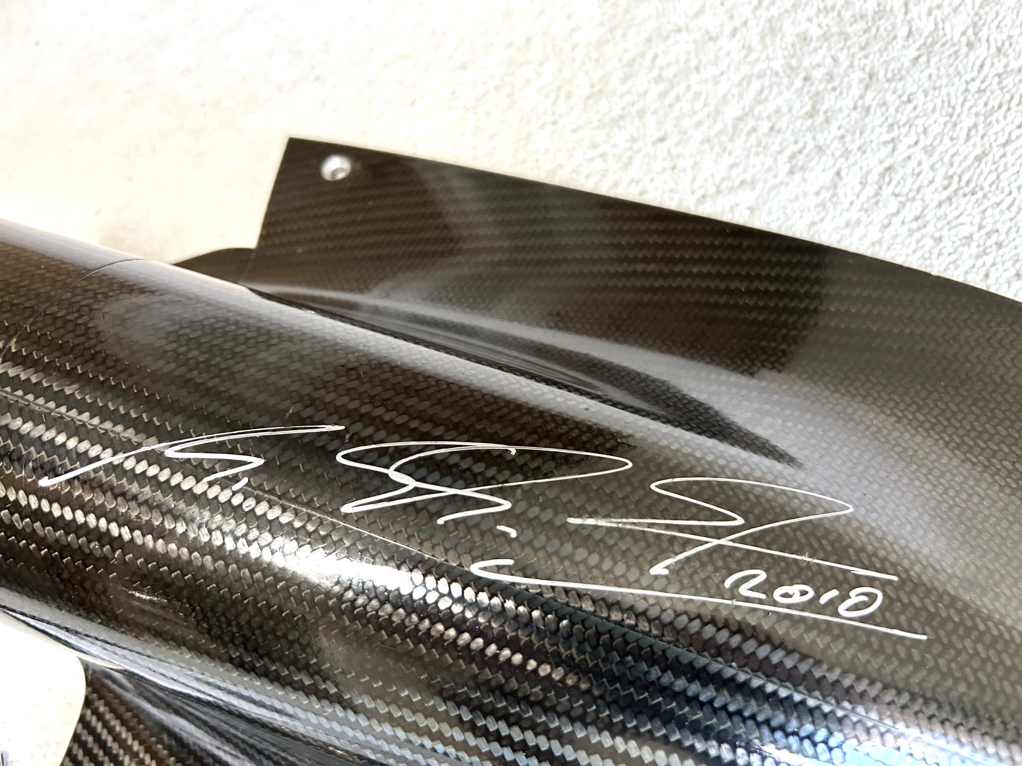 2010 AMG Mercedes GP carbon exhaust shield signed by Michael Schumacher and Nico Rosberg with team COA - Image 2