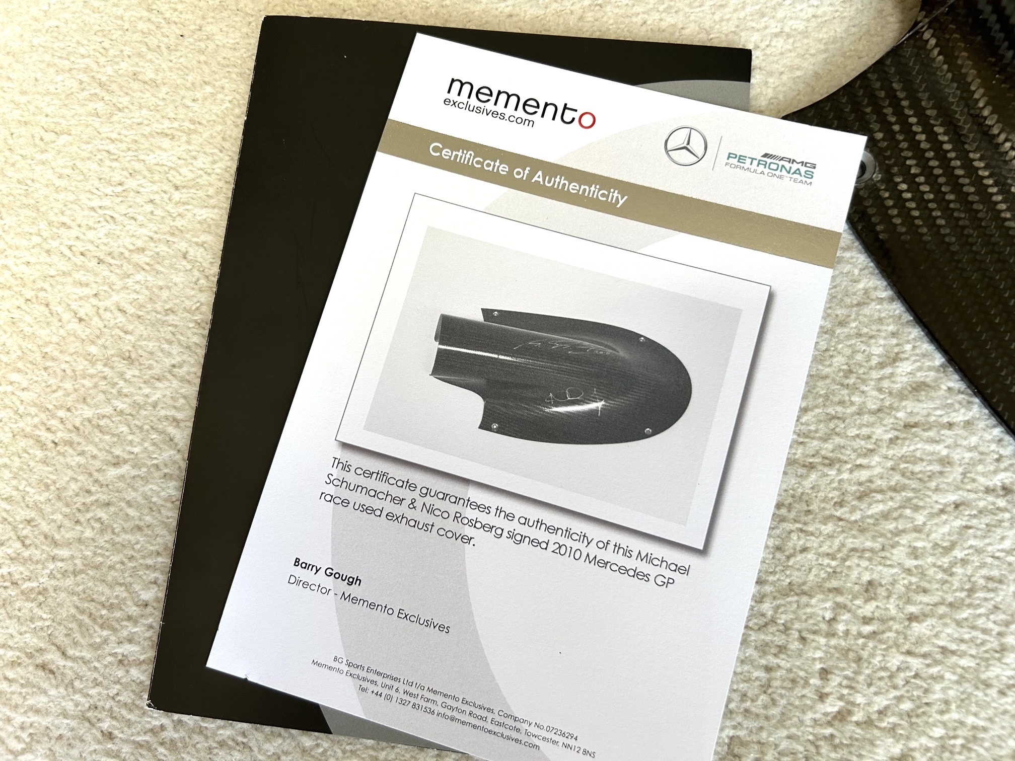 2010 AMG Mercedes GP carbon exhaust shield signed by Michael Schumacher and Nico Rosberg with team COA - Image 3